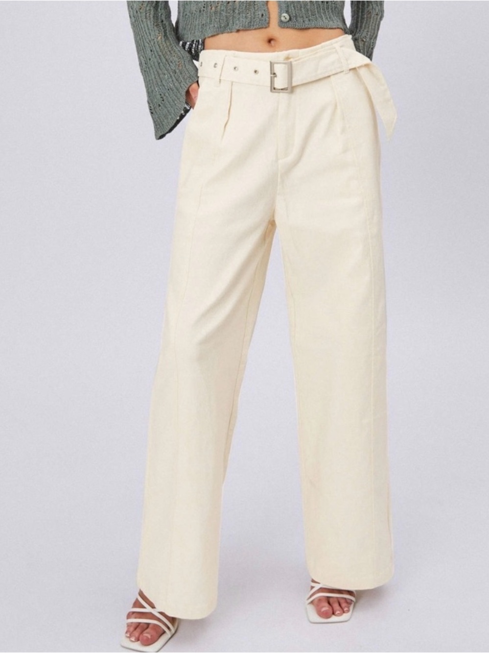 Cider wide-leg cotton pants featuring a belted waist and pleated front. New